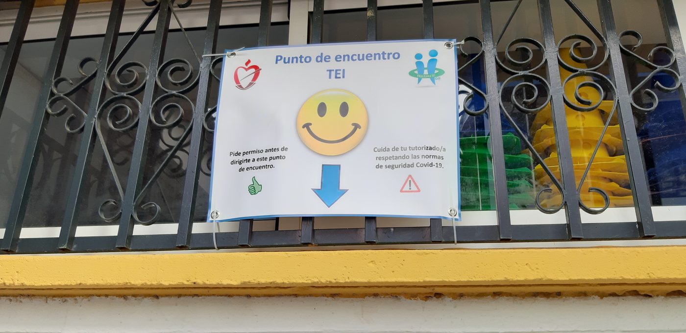 Cartel del punto de encuentro del programa TEI con las normas de seguridad frente a la Covid-19